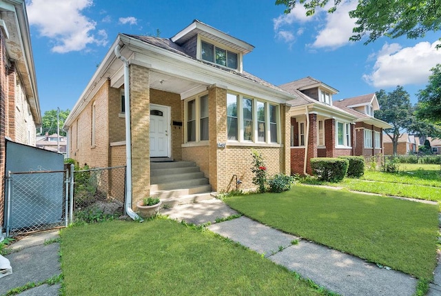 3408 W Marquette Rd, Chicago, IL 60629 - view of front of house with brick siding and a gate