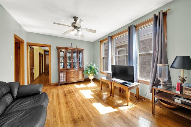 3408 W Marquette Rd, Chicago, IL 60629 - living room featuring light wood-style floors and a ceiling fan