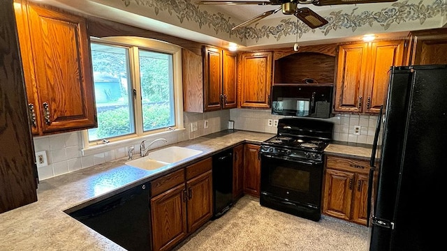 16179 Greenland Dr, Morrison, IL 61270 - kitchen with black appliances, a ceiling fan, light carpet, and decorative backsplash