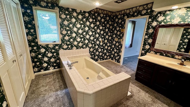 16179 Greenland Dr, Morrison, IL 61270 - full bathroom with wallpapered walls, a closet, vanity, and a bath