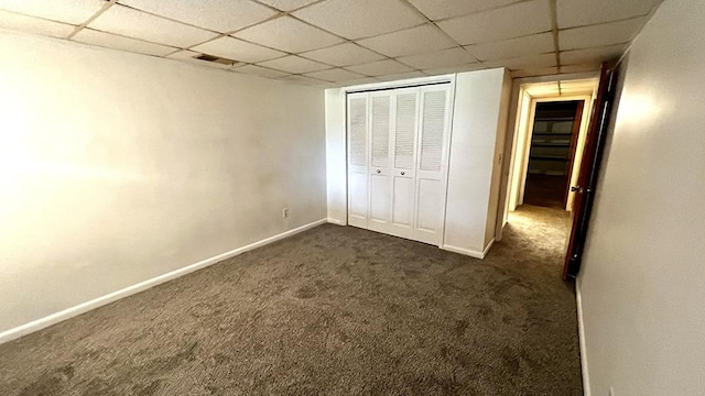 16179 Greenland Dr, Morrison, IL 61270 - unfurnished bedroom with dark carpet, a paneled ceiling, and a closet