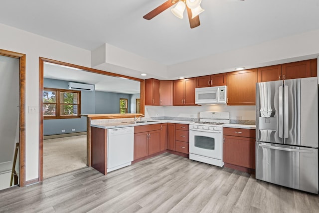 144 Greenley St, Woodstock, IL 60098 - kitchen featuring white appliances, a wall mounted AC, light countertops, light wood finished floors, and ceiling fan