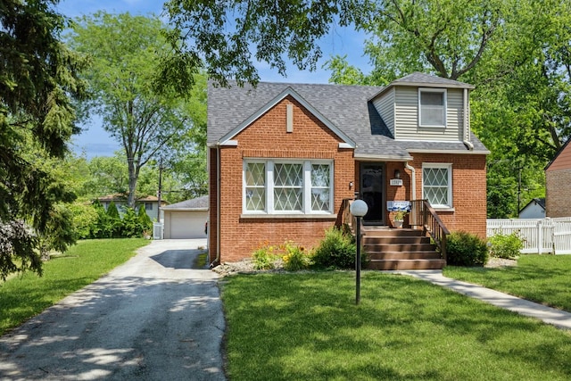 22427 Ridgeway Ave, Richton Park, IL 60471 - view of front of house with a detached garage, brick siding, an outdoor structure, and a shingled roof