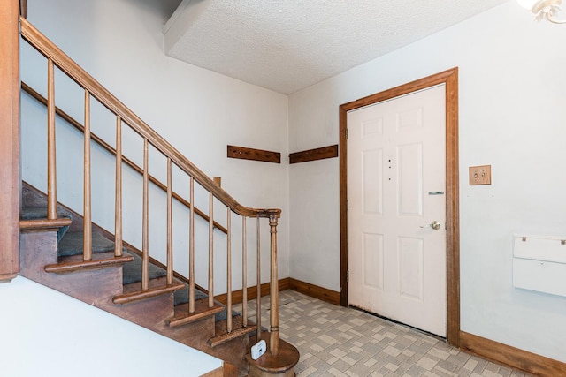 536 Center Ave, Sycamore, IL 60178 - entrance foyer featuring stairway and a textured ceiling