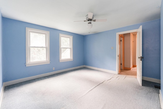 536 Center Ave, Sycamore, IL 60178 - carpeted spare room featuring baseboards and ceiling fan