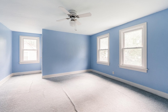 536 Center Ave, Sycamore, IL 60178 - carpeted empty room with ceiling fan and healthy amount of natural light