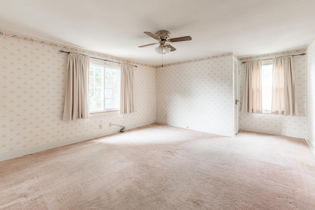 536 Center Ave, Sycamore, IL 60178 - empty room featuring wallpapered walls, ceiling fan, and light colored carpet