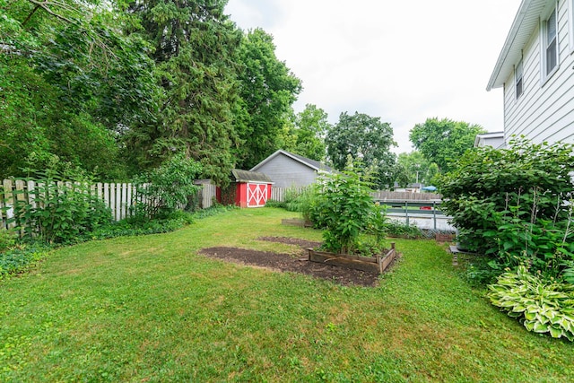 536 Center Ave, Sycamore, IL 60178 - fenced backyard with a storage shed and a garden