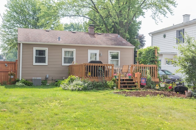 204 N Elroy Ave, Bartlett, IL 60103 - rear view of house with a deck, a lawn, a chimney, and a shingled roof