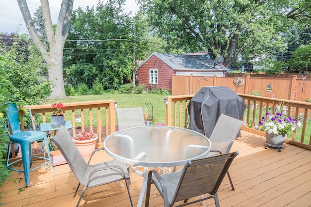 204 N Elroy Ave, Bartlett, IL 60103 - deck with outdoor dining area, a grill, and view of scattered trees