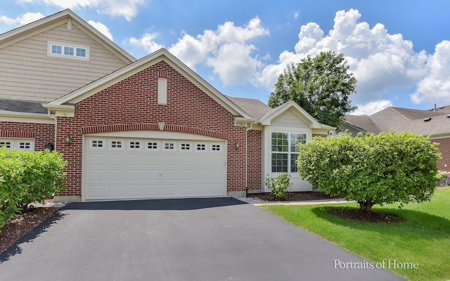 2065 John Paul Jones Ln Unit 2065, Bolingbrook, IL 60490 - view of front of house with brick siding, asphalt driveway, and a garage