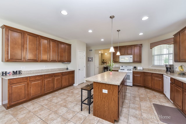 2065 John Paul Jones Ln Unit 2065, Bolingbrook, IL 60490 - kitchen featuring white appliances, a center island, recessed lighting, a kitchen breakfast bar, and brown cabinets
