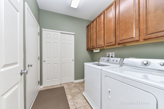 2065 John Paul Jones Ln Unit 2065, Bolingbrook, IL 60490 - laundry room with washing machine and clothes dryer, cabinet space, and light tile patterned flooring
