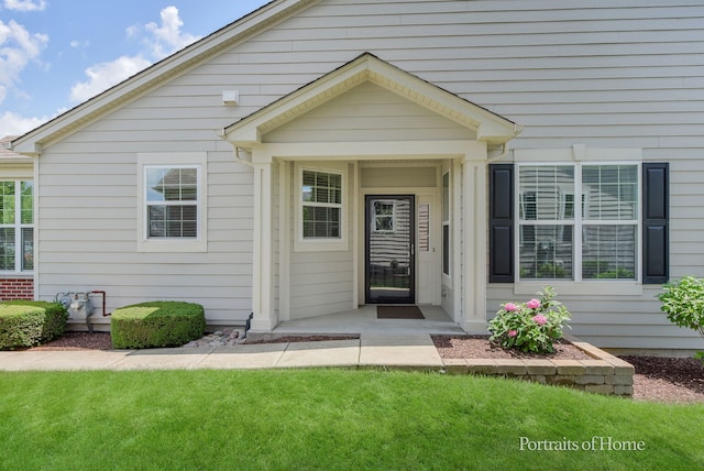 2065 John Paul Jones Ln Unit 2065, Bolingbrook, IL 60490 - doorway to property with a lawn