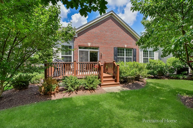 2065 John Paul Jones Ln Unit 2065, Bolingbrook, IL 60490 - back of property with brick siding, a lawn, and a deck