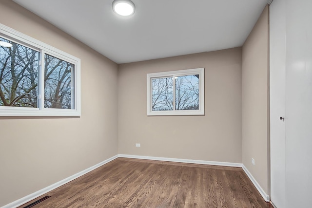 335 Farragut St, Park Forest, IL 60466 - empty room with dark wood-type flooring and baseboards