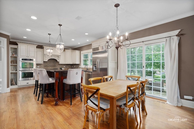 3704 Heathmoor Dr, Elgin, IL 60124 - dining area featuring crown molding, a chandelier, light wood-style flooring, and recessed lighting