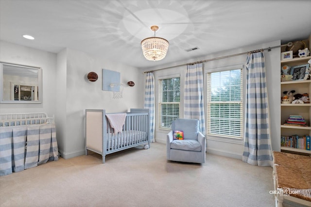 3704 Heathmoor Dr, Elgin, IL 60124 - bedroom with carpet flooring, a nursery area, and a chandelier