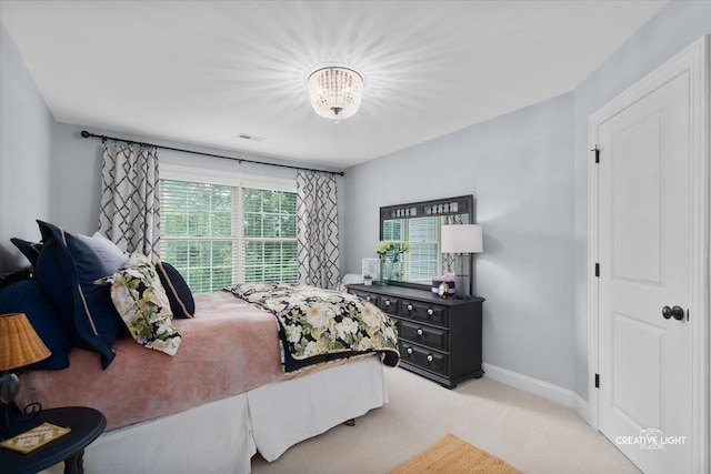 3704 Heathmoor Dr, Elgin, IL 60124 - carpeted bedroom with baseboards and a chandelier