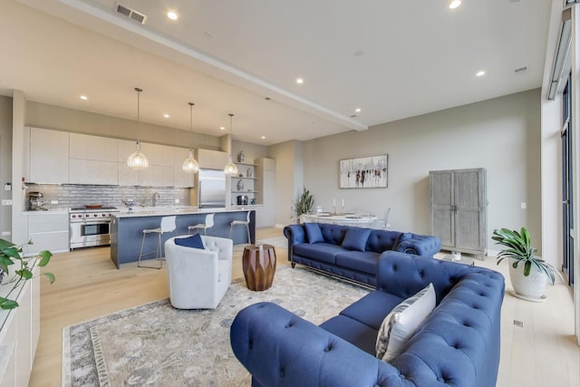 2405 W Iowa St Unit 405, Chicago, IL 60622 - living area with recessed lighting and light wood-style floors