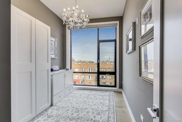 2405 W Iowa St Unit 405, Chicago, IL 60622 - unfurnished bedroom with a chandelier and light wood-type flooring