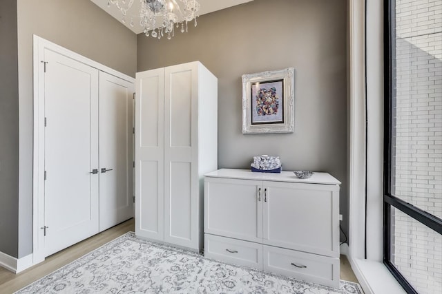 2405 W Iowa St Unit 405, Chicago, IL 60622 - interior space featuring a chandelier and light wood-style floors