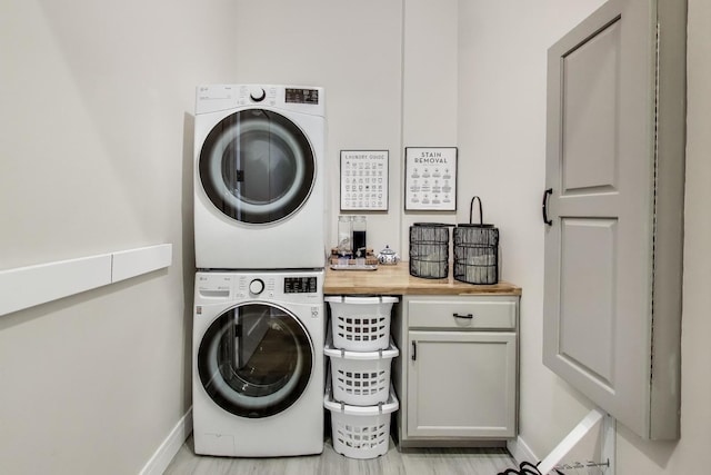 2405 W Iowa St Unit 405, Chicago, IL 60622 - laundry room with stacked washer / dryer and cabinet space