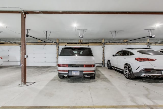 2405 W Iowa St Unit 405, Chicago, IL 60622 - parking deck featuring a garage door opener