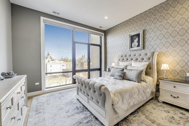 2405 W Iowa St Unit 405, Chicago, IL 60622 - bedroom with an accent wall and recessed lighting