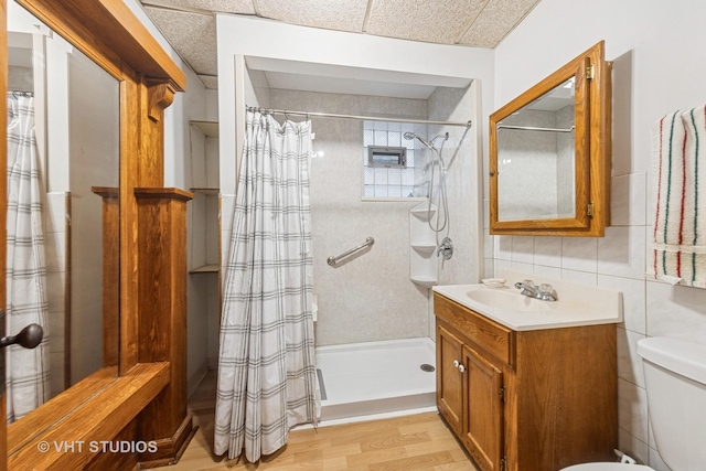 925 W 31st St, Chicago, IL 60608 - bathroom with vanity, wood finished floors, a shower with curtain, tile walls, and a bidet