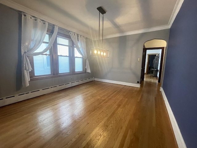 2918 N Normandy Ave, Chicago, IL 60634 - unfurnished dining area with crown molding, wood finished floors, a baseboard heating unit, and a chandelier