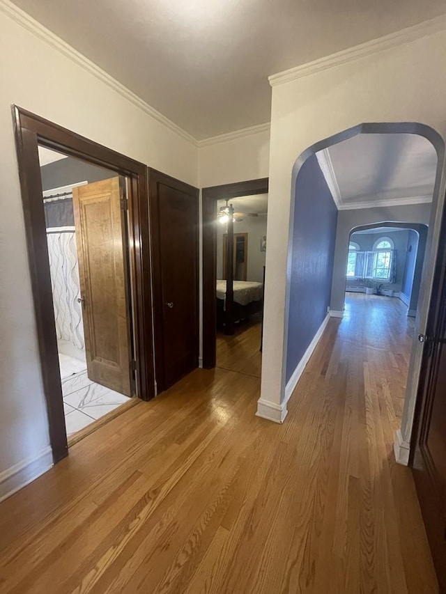 2918 N Normandy Ave, Chicago, IL 60634 - corridor featuring arched walkways, wood finished floors, and crown molding