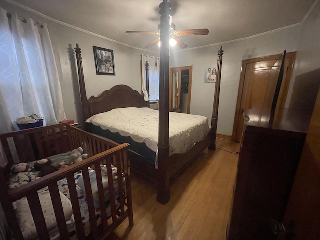 2918 N Normandy Ave, Chicago, IL 60634 - bedroom featuring light wood-style floors, ceiling fan, and ornamental molding