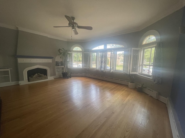 2918 N Normandy Ave, Chicago, IL 60634 - unfurnished living room with healthy amount of natural light, a fireplace with raised hearth, wood finished floors, ornamental molding, and a ceiling fan