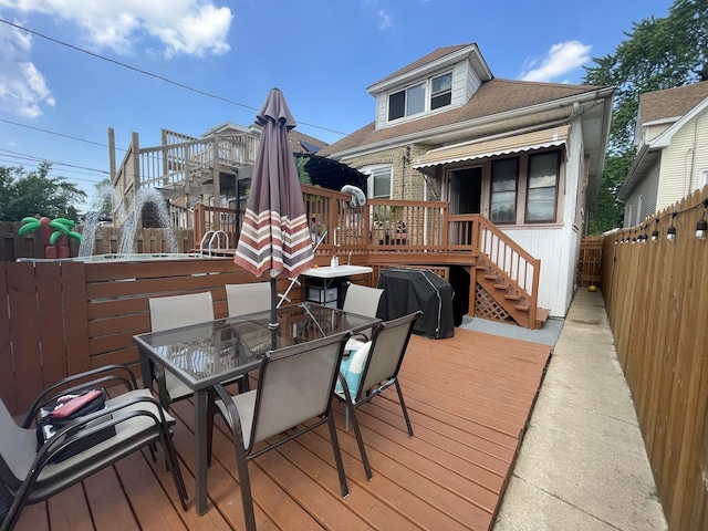 2918 N Normandy Ave, Chicago, IL 60634 - wooden deck with a fenced backyard, outdoor dining area, and stairs