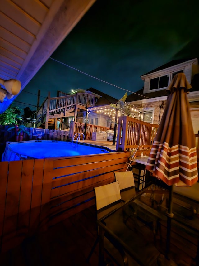 2918 N Normandy Ave, Chicago, IL 60634 - pool at night with outdoor dining area and a deck