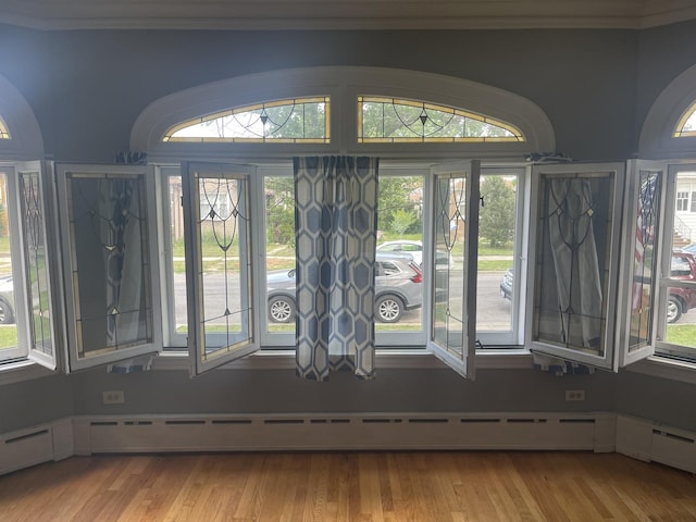 2918 N Normandy Ave, Chicago, IL 60634 - detailed view of crown molding, wood finished floors, and baseboard heating