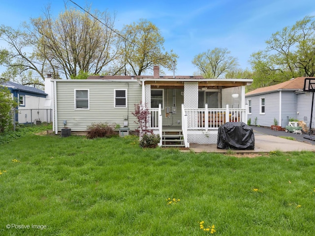 307 N Schubert St, Palatine, IL 60067 - rear view of property featuring a yard and a chimney