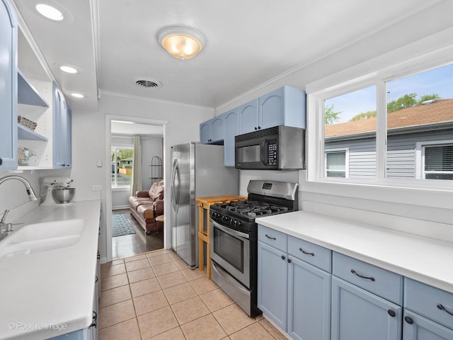307 N Schubert St, Palatine, IL 60067 - kitchen with appliances with stainless steel finishes, open shelves, light tile patterned floors, ornamental molding, and light countertops