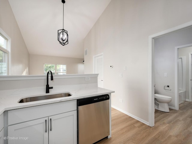 2804 River Bend Ln, Plainfield, IL 60586 - kitchen featuring dishwasher, light wood-type flooring, decorative light fixtures, light stone counters, and white cabinets
