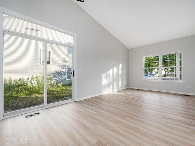 2804 River Bend Ln, Plainfield, IL 60586 - spare room with vaulted ceiling and wood finished floors
