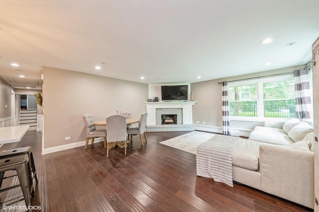 1715 Chesterfield Ave, Glen Ellyn, IL 60137 - living area with dark wood-style flooring, a brick fireplace, a baseboard heating unit, and recessed lighting