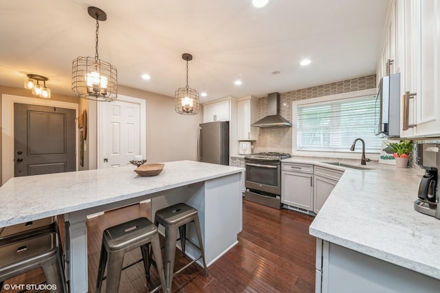 1715 Chesterfield Ave, Glen Ellyn, IL 60137 - kitchen with appliances with stainless steel finishes, wall chimney range hood, a kitchen bar, backsplash, and light stone countertops