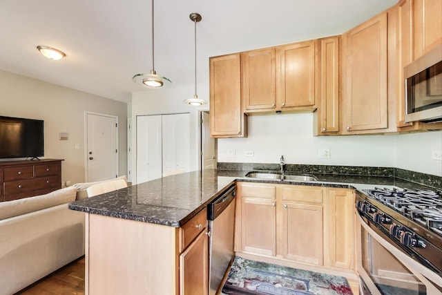 3005 N Clifton Ave Unit 201, Chicago, IL 60657 - kitchen with appliances with stainless steel finishes, open floor plan, dark stone countertops, a peninsula, and light brown cabinets
