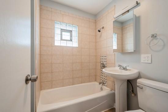 3131 N Odell Ave, Chicago, IL 60707 - bathroom with toilet and bathtub / shower combination