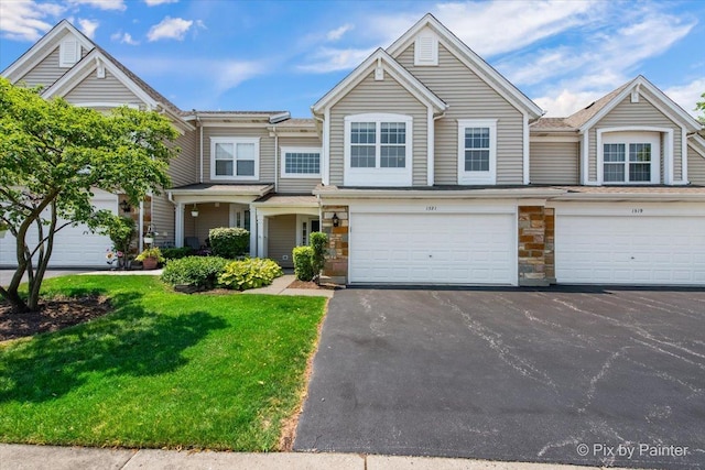 1521 E Baronet Ln, Palatine, IL 60074 - multi unit property featuring a front lawn, driveway, an attached garage, and stone siding