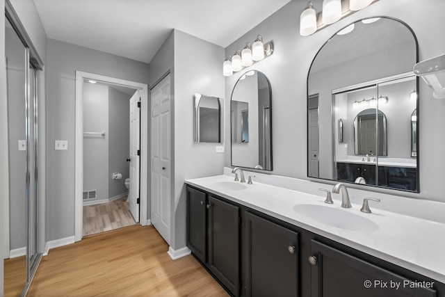 1521 E Baronet Ln, Palatine, IL 60074 - bathroom with double vanity and wood finished floors
