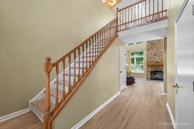 1521 E Baronet Ln, Palatine, IL 60074 - stairway with wood finished floors, a fireplace, and a high ceiling