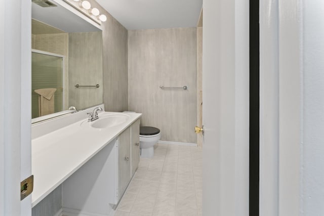 2319 E Olive St Unit 1D, Arlington Heights, IL 60004 - bathroom featuring a stall shower, vanity, and tile patterned flooring