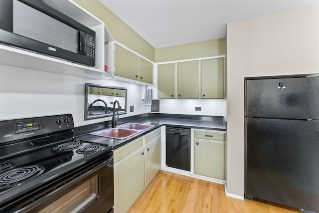 2319 E Olive St Unit 1D, Arlington Heights, IL 60004 - kitchen with black appliances, light wood-style flooring, and dark countertops